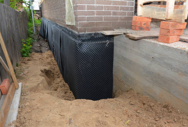 SJ Waterproofing Pros technician performing targeted Waterproofing assessment in Lincolnwood, IL